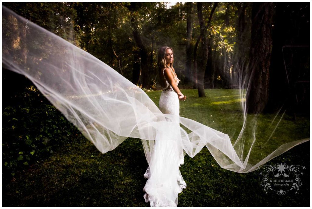 Bride with long veil at her Napa Valley wedding