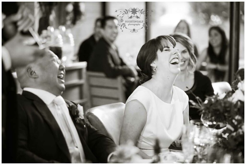 Bride in Sonoma laughs at her wedding reception