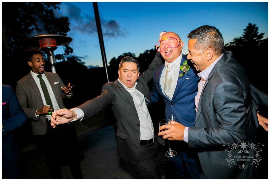Party guests laugh at Sonoma wedding reception
