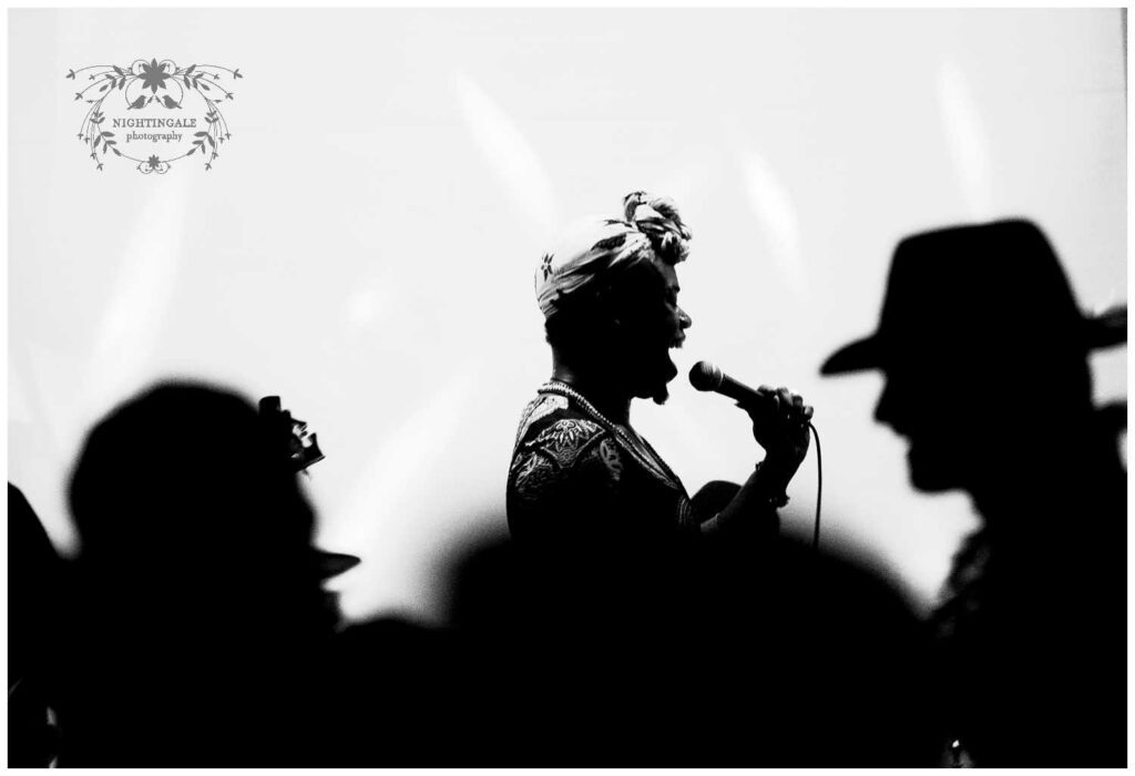 Artistic black and white photo of wedding singer at reception in the Bay Area
