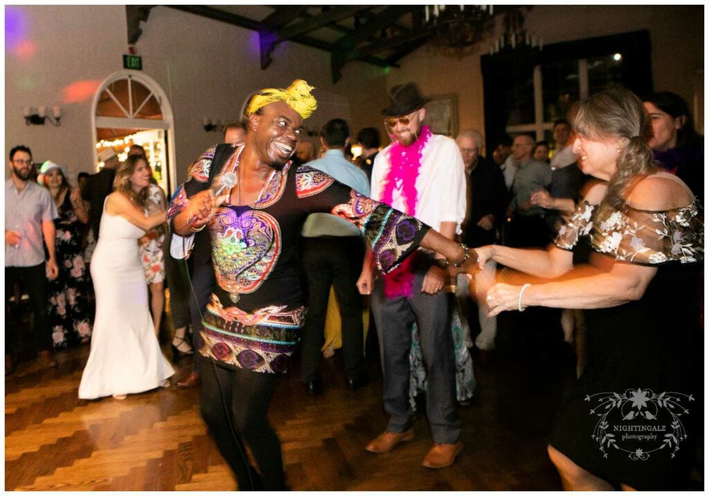 Wedding singer dances with guests at Piedmont Community Hall