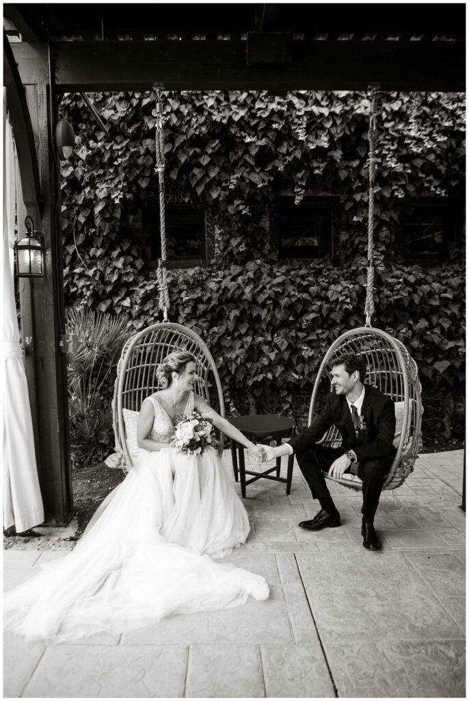 modern black and white wedding photo of couple at winery