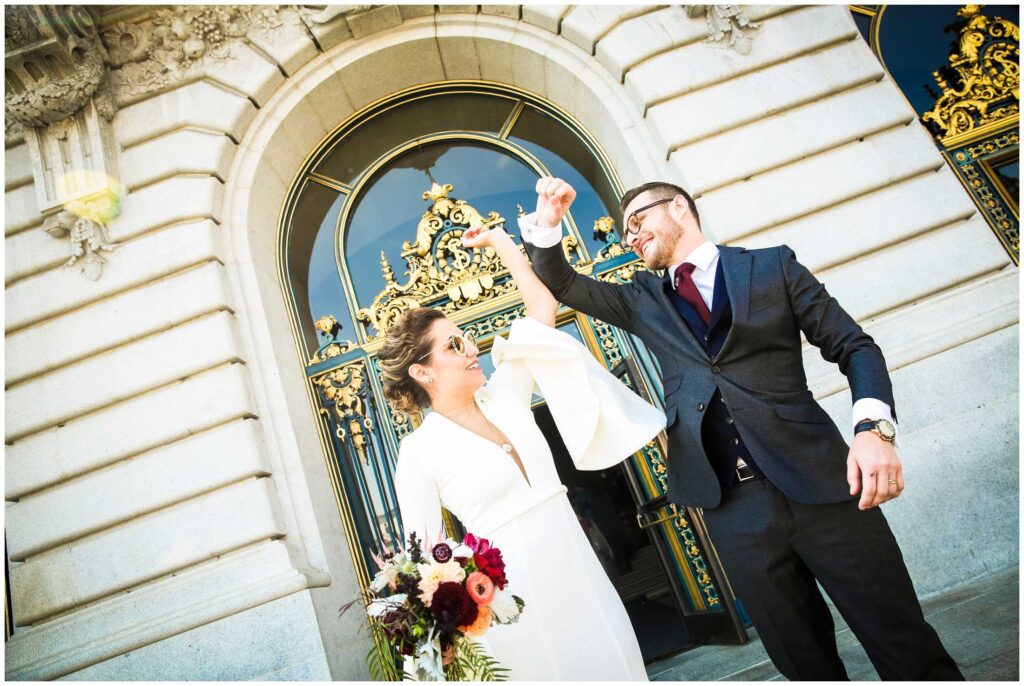 Couple exits San Francisco City  Hall after their ceremony