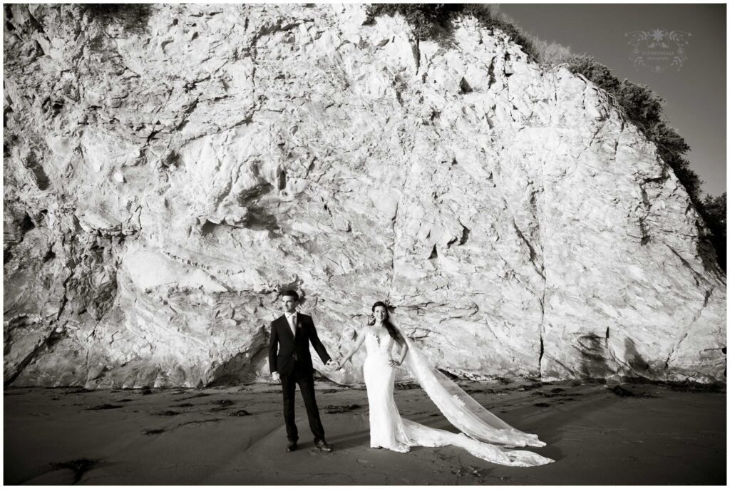 black and white portrait of couple at their beach wedding at rancho dos pueblos santa barbara