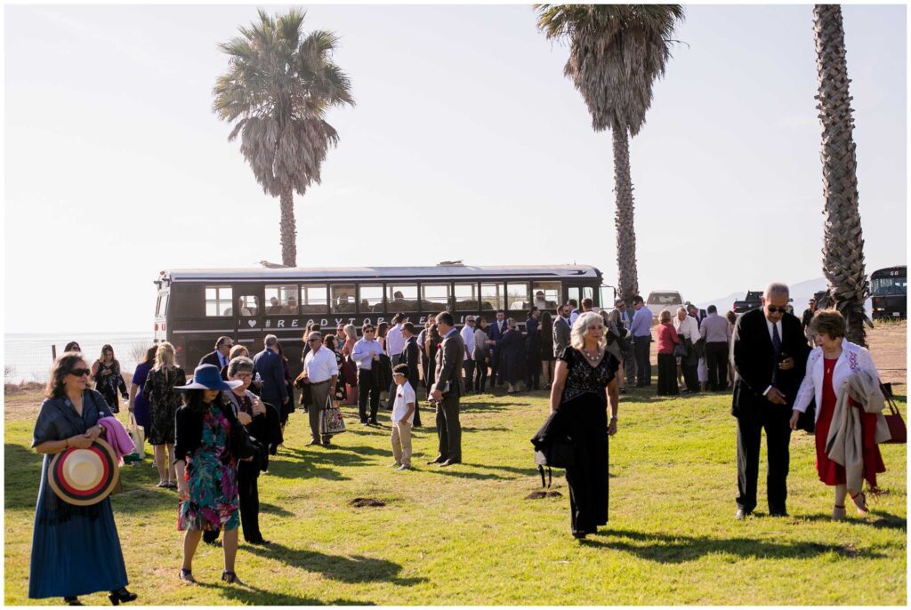 party bus shuttles guests to outdoor santa barbara wedding