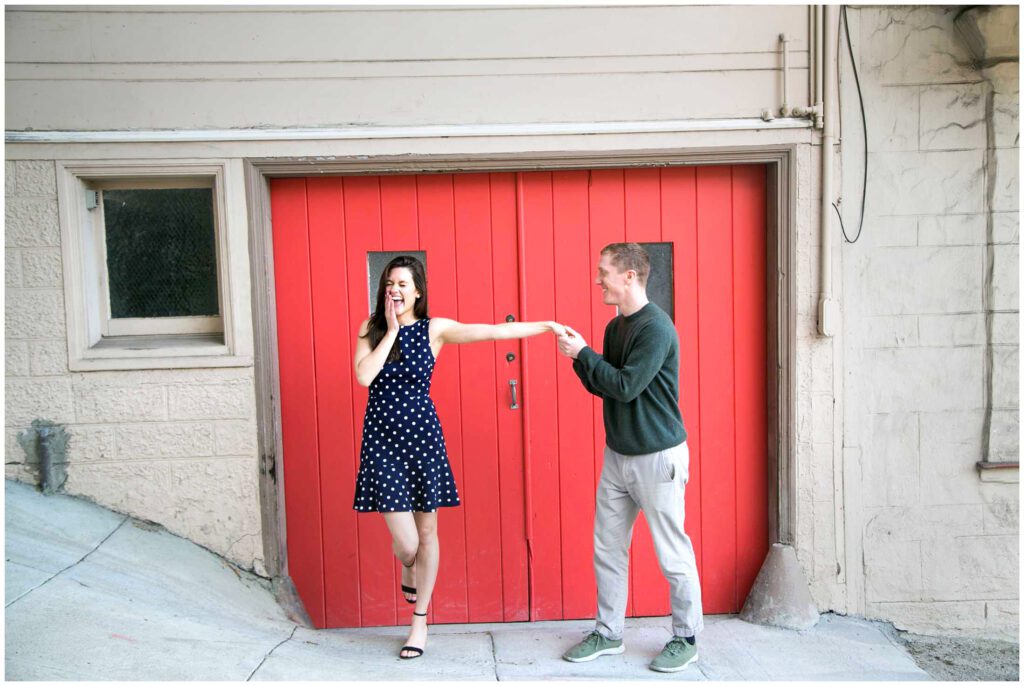 Couples portraits in front of a red door in North Beach San Francisco