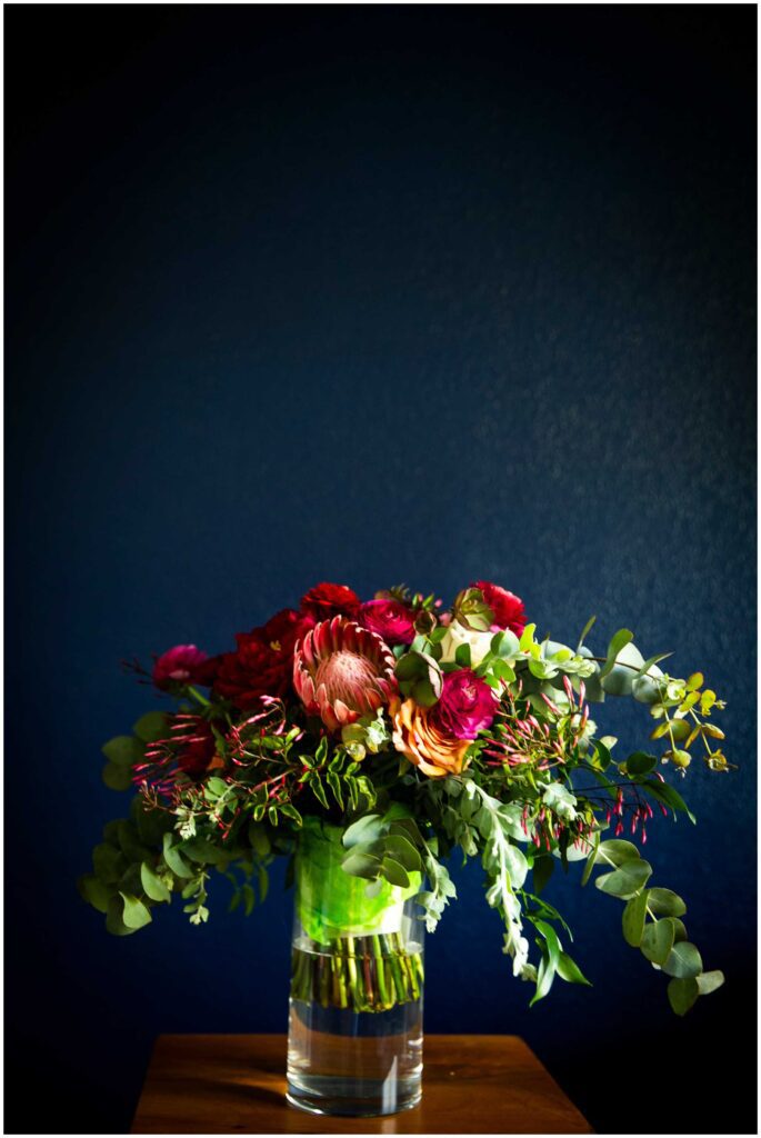 lush bouquet against blue wall