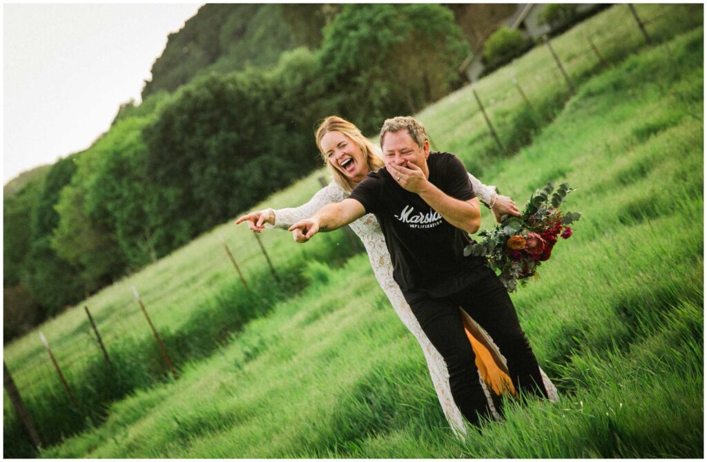 candid wedding portrait of couple laughing