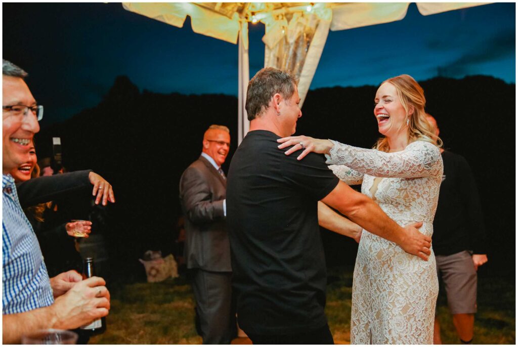 couple dances at their backyard wedding reception