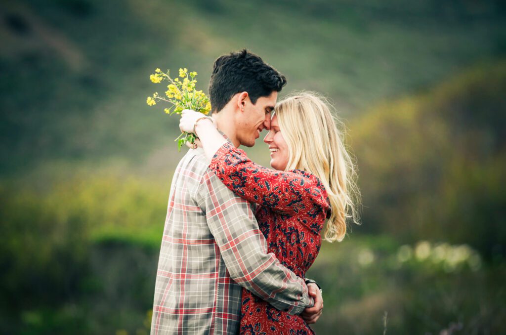 San Francisco engagement photographer - couple outdoors with flowers by Nightingale Photography