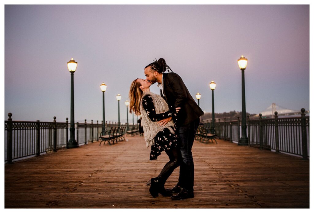 couple kissing on Pier 7 in San Francisco